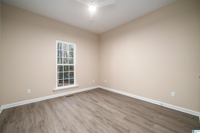 spare room featuring ceiling fan and light hardwood / wood-style floors