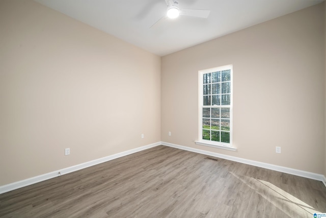 spare room with ceiling fan and light hardwood / wood-style floors