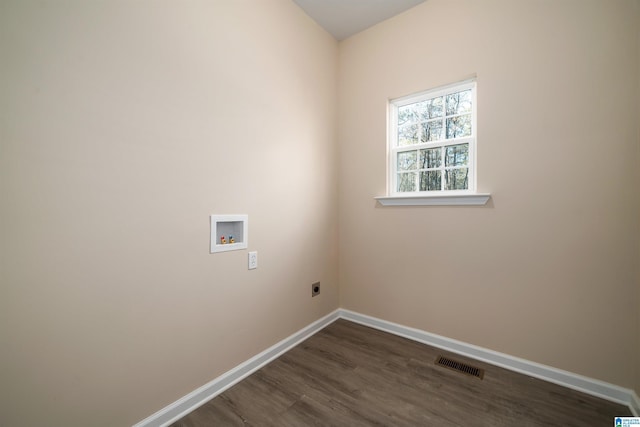 washroom featuring dark wood-type flooring, washer hookup, and electric dryer hookup