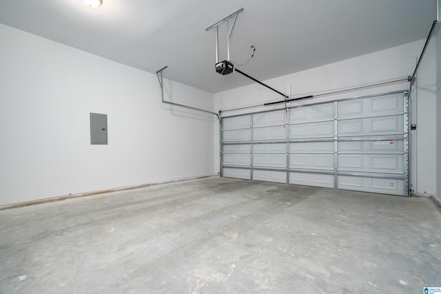 garage with a garage door opener and electric panel