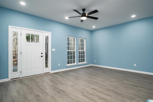 entrance foyer featuring ceiling fan and hardwood / wood-style flooring