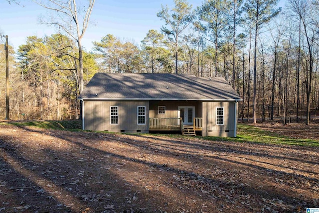 rear view of house with french doors and a deck