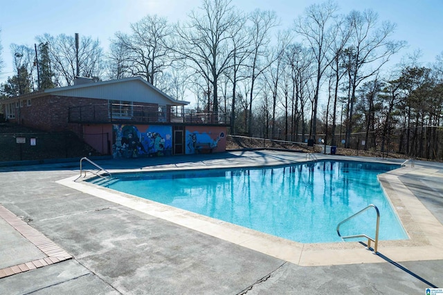 view of swimming pool featuring a patio area