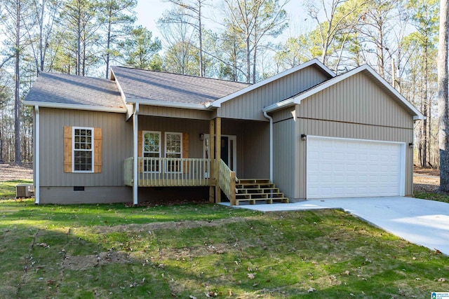 ranch-style house featuring a front yard, covered porch, and a garage