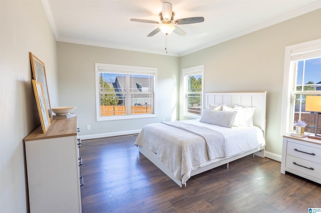 bedroom featuring ceiling fan, dark hardwood / wood-style floors, and ornamental molding