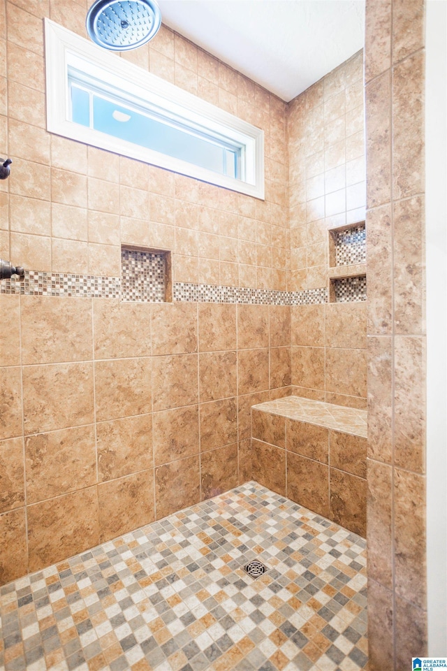 bathroom featuring tiled shower