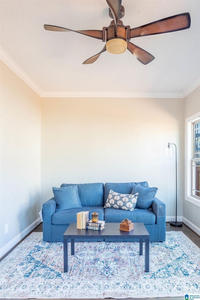 living room featuring hardwood / wood-style flooring, ceiling fan, and ornamental molding