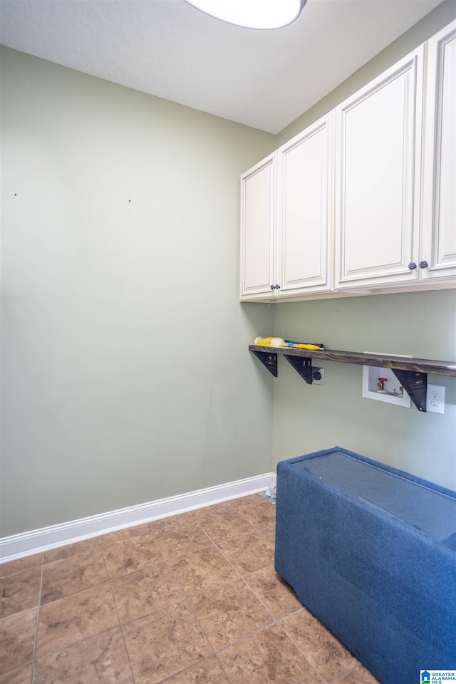 laundry area with cabinets and hookup for a washing machine