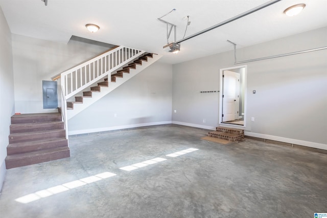 garage with electric panel and a garage door opener