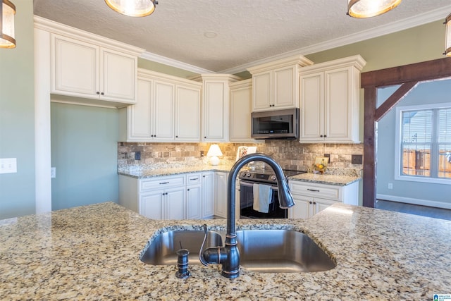 kitchen featuring light stone counters, ornamental molding, sink, and tasteful backsplash