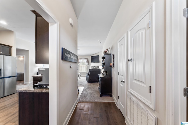 hallway featuring dark wood-type flooring