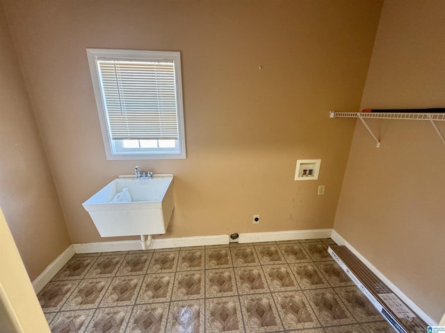 clothes washing area with hookup for an electric dryer, sink, and hookup for a washing machine