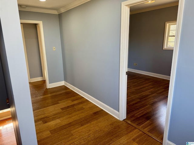 hallway featuring dark hardwood / wood-style floors and crown molding