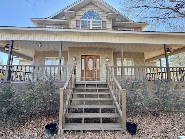 view of exterior entry with a porch