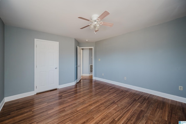 unfurnished bedroom featuring ceiling fan and dark hardwood / wood-style floors