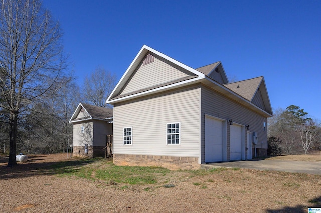 view of side of home with a garage