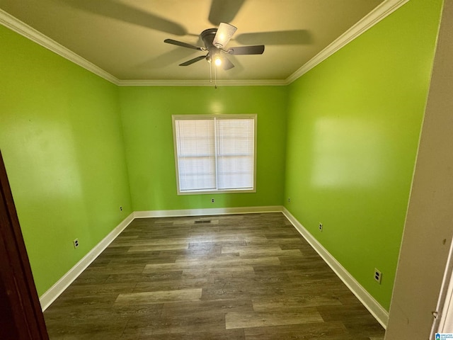 empty room with dark hardwood / wood-style flooring, ceiling fan, and ornamental molding