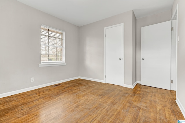 unfurnished bedroom featuring wood-type flooring