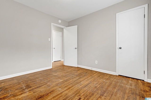 spare room featuring hardwood / wood-style flooring