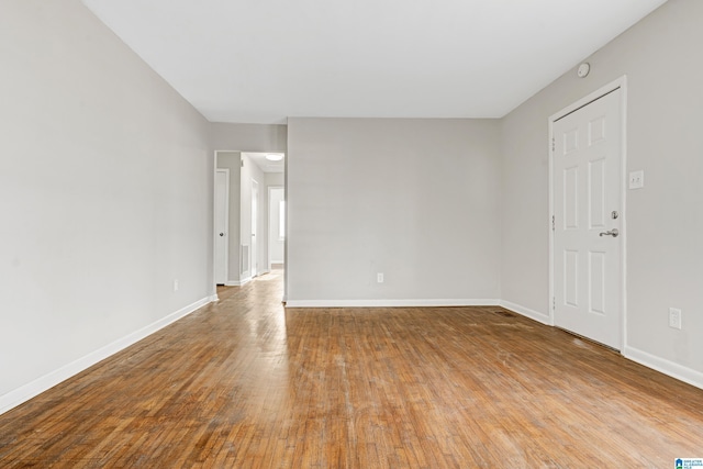 spare room featuring light wood-type flooring