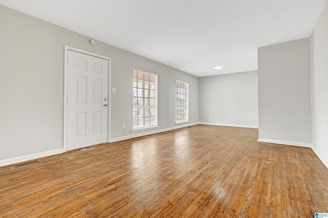 spare room with light hardwood / wood-style flooring