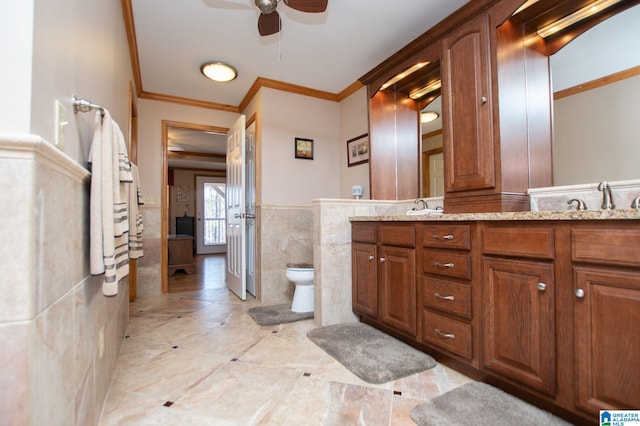 395 Creek Run Rd, Wedowee, AL 36278 - bathroom with double vanity, a sink, wainscoting, crown molding, and tile walls