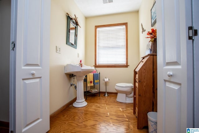 395 Creek Run Rd, Wedowee, AL 36278 - bathroom with toilet, wood finished floors, visible vents, and baseboards