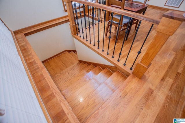 395 Creek Run Rd, Wedowee, AL 36278 - staircase featuring wood finished floors, visible vents, and baseboards