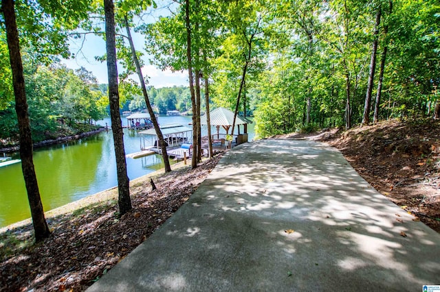 395 Creek Run Rd, Wedowee, AL 36278 - exterior space with boat lift, a water view, a view of trees, and a dock