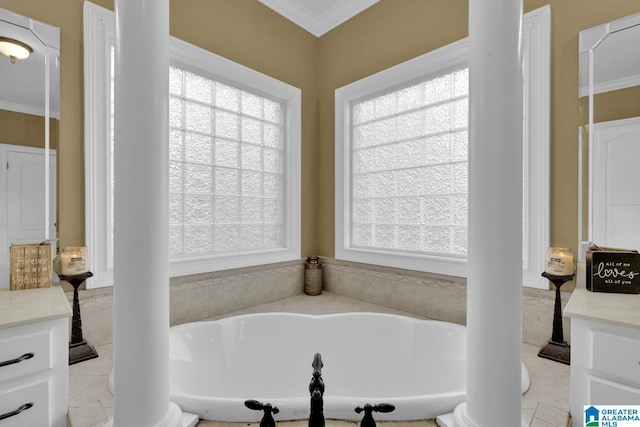 bathroom with vanity, a healthy amount of sunlight, ornamental molding, and ornate columns