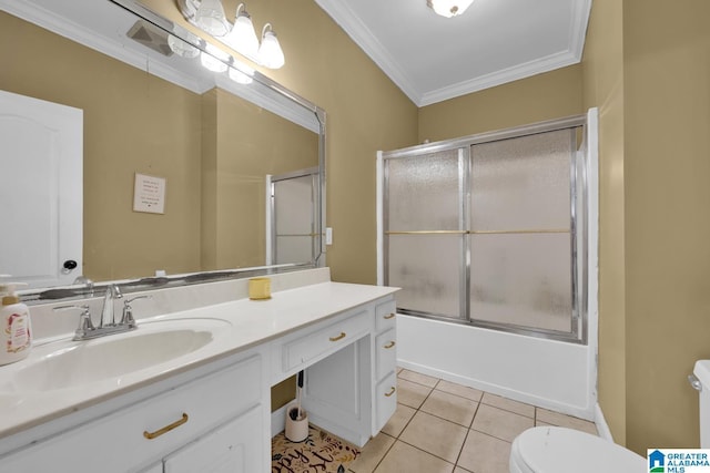 full bathroom featuring vanity, crown molding, tile patterned flooring, toilet, and enclosed tub / shower combo