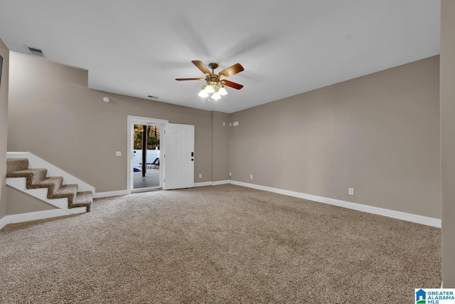 unfurnished room with ceiling fan and carpet floors