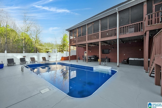 view of swimming pool featuring a patio area