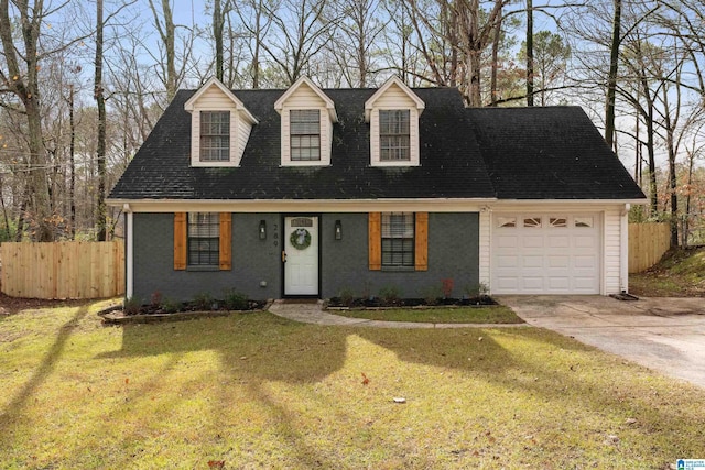 cape cod home featuring a garage and a front yard