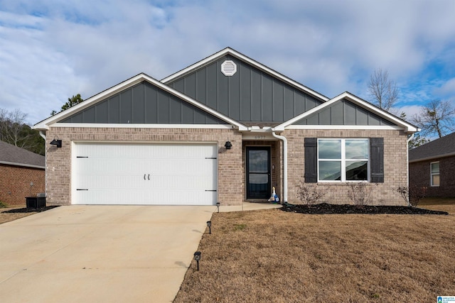 view of front of house with a front yard and a garage