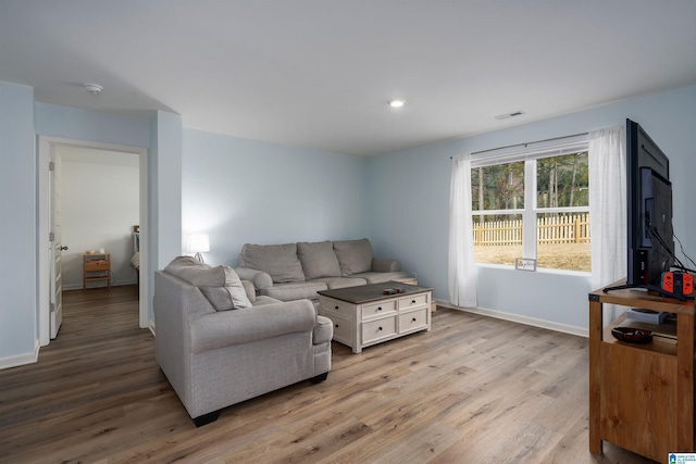 living room with light hardwood / wood-style floors