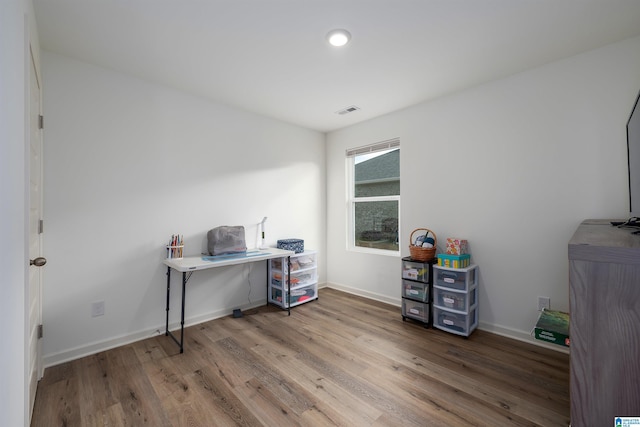 office space with hardwood / wood-style flooring