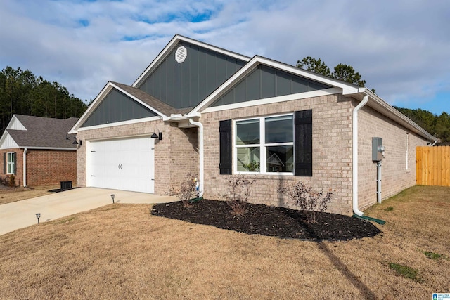 view of front facade featuring a front yard and a garage