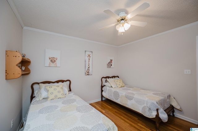 bedroom featuring a textured ceiling, hardwood / wood-style flooring, ceiling fan, and crown molding