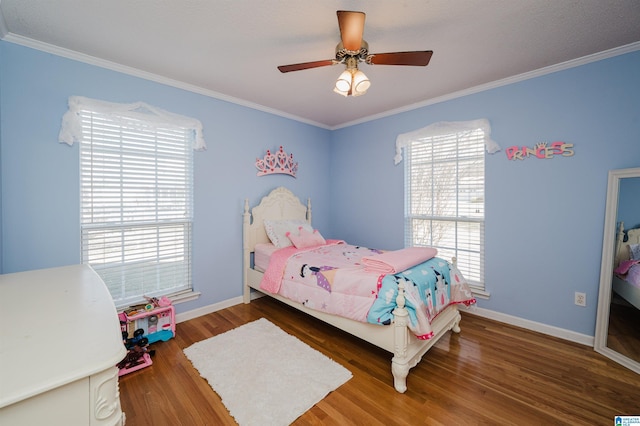 bedroom featuring ceiling fan, dark hardwood / wood-style flooring, and ornamental molding