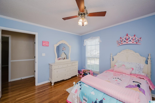 bedroom with ceiling fan, dark wood-type flooring, a textured ceiling, and ornamental molding