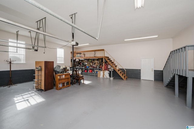 garage featuring a workshop area and a garage door opener