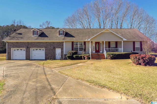 view of front of home with a front yard, a garage, and covered porch