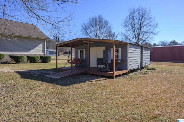 view of outbuilding featuring a yard