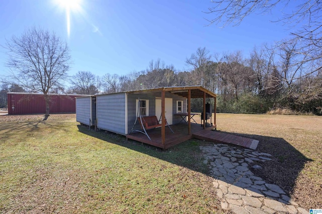 view of outbuilding featuring a yard