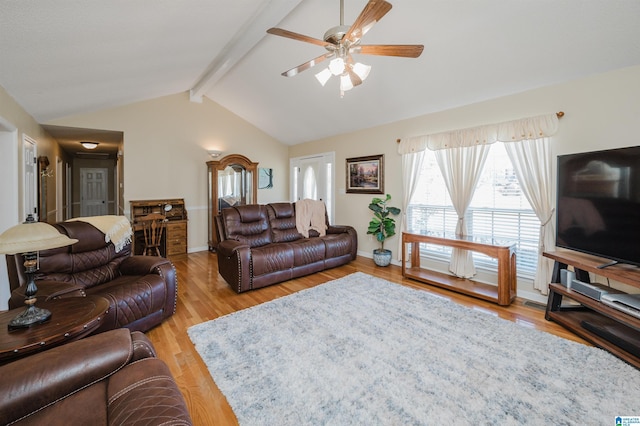 living room featuring vaulted ceiling with beams, hardwood / wood-style flooring, and ceiling fan