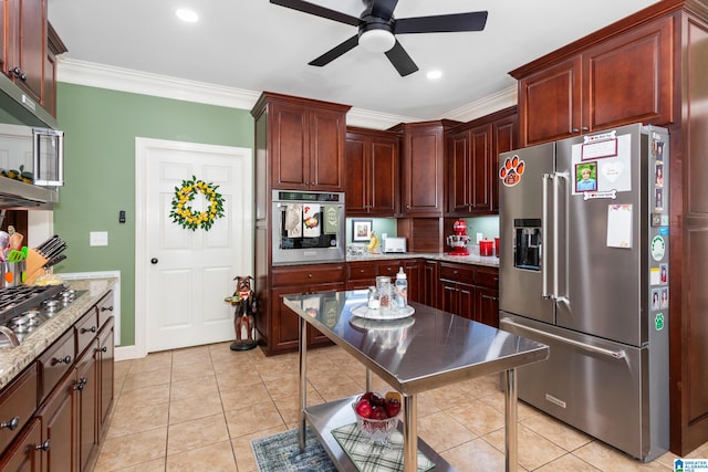 kitchen featuring ceiling fan, light tile patterned floors, ornamental molding, and appliances with stainless steel finishes