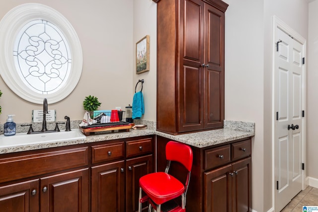 bathroom with tile patterned flooring and vanity