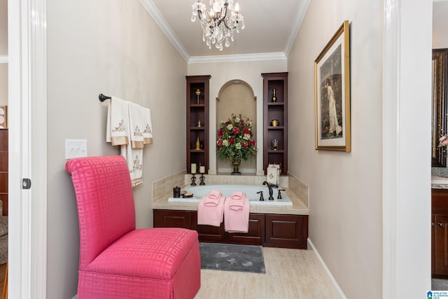 bathroom with crown molding, a washtub, vanity, and an inviting chandelier