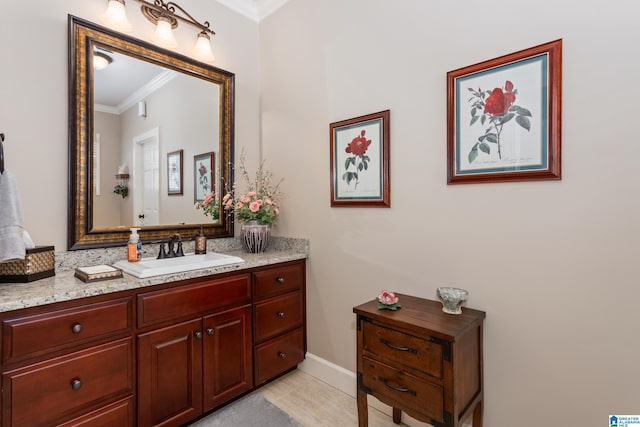 bathroom with vanity and ornamental molding